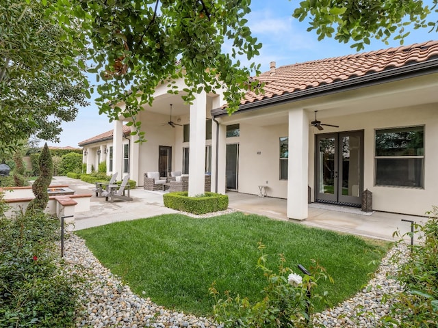 2567 E Sarazen, Fresno, CA 93730 - back of property with a ceiling fan, a patio, outdoor lounge area, and a lawn