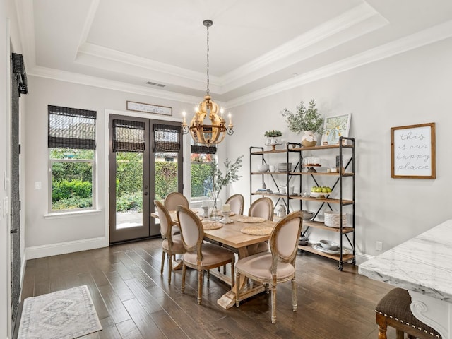 2567 E Sarazen, Fresno, CA 93730 - dining area featuring a tray ceiling, a chandelier, dark wood-type flooring, and crown molding