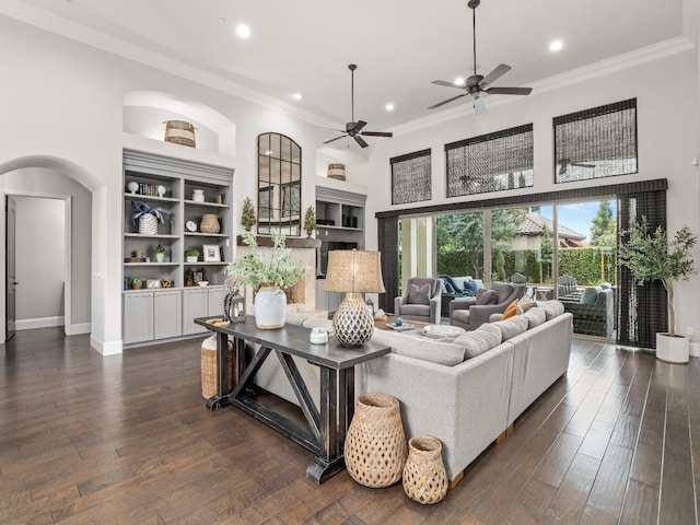 2567 E Sarazen, Fresno, CA 93730 - living area with ceiling fan, crown molding, recessed lighting, a high ceiling, and arched walkways