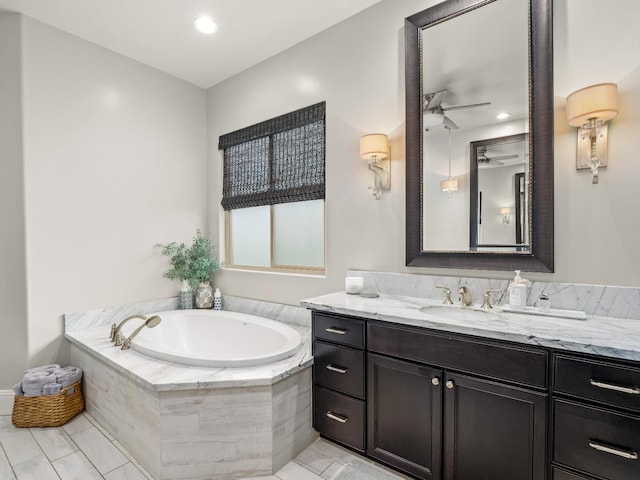 2567 E Sarazen, Fresno, CA 93730 - full bath with vanity, a garden tub, a ceiling fan, tile patterned floors, and recessed lighting