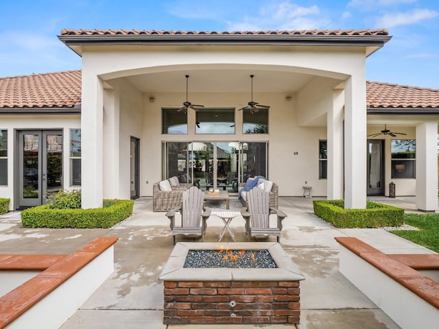 2567 E Sarazen, Fresno, CA 93730 - view of patio with ceiling fan, french doors, and an outdoor living space with a fire pit