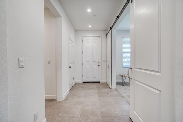 377 Wishon Way W, Madera, CA 93636 - hallway with a barn door, recessed lighting, and light tile patterned floors