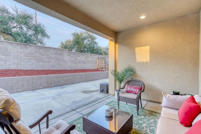 377 Wishon Way W, Madera, CA 93636 - fenced backyard featuring a patio area and an outdoor hangout area