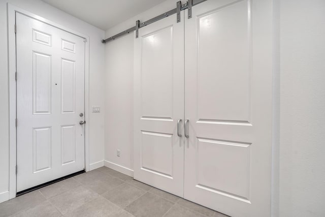377 Wishon Way W, Madera, CA 93636 - entrance foyer with a barn door and light tile patterned floors