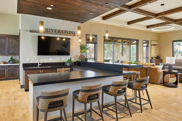 377 Wishon Way W, Madera, CA 93636 - kitchen featuring dark brown cabinets, coffered ceiling, open floor plan, beamed ceiling, and dark countertops