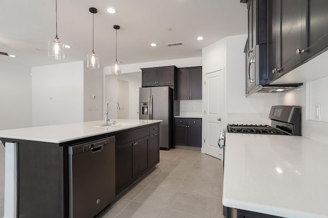 377 Wishon Way W, Madera, CA 93636 - kitchen featuring dishwashing machine, stainless steel refrigerator with ice dispenser, light tile patterned floors, light countertops, and an island with sink