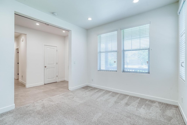 377 Wishon Way W, Madera, CA 93636 - tiled empty room featuring recessed lighting, carpet flooring, and a smoke detector