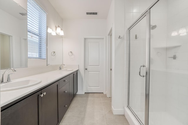377 Wishon Way W, Madera, CA 93636 - full bathroom with a shower stall, double vanity, and tile patterned flooring