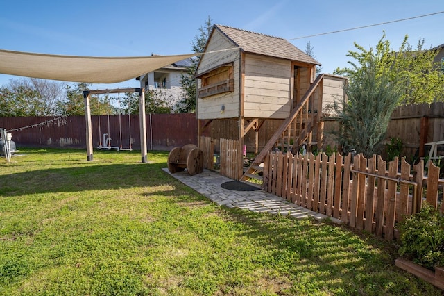 view of yard featuring an outbuilding and a fenced backyard