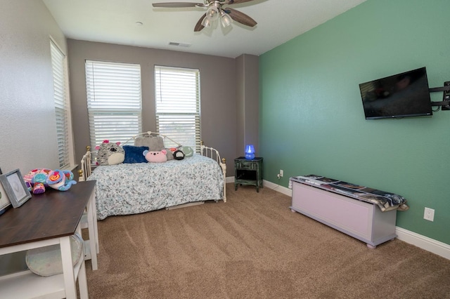 carpeted bedroom featuring visible vents, ceiling fan, and baseboards