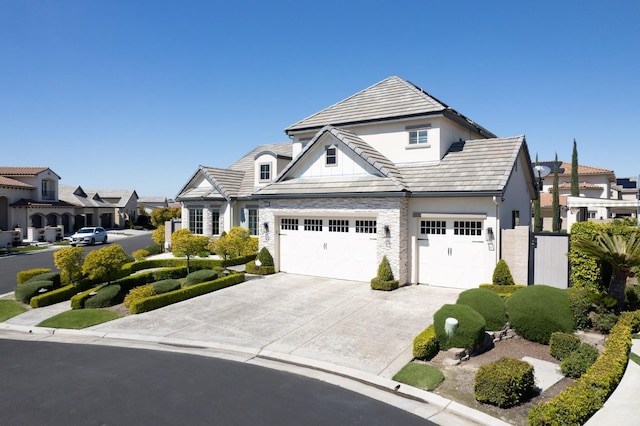 view of front facade featuring stucco siding, a garage, and concrete driveway