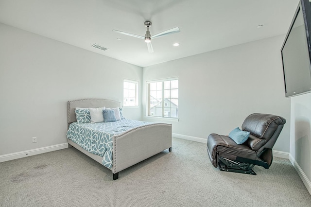 carpeted bedroom with ceiling fan, baseboards, and visible vents