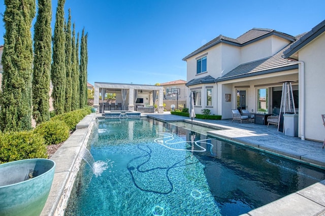 view of pool with a pool with connected hot tub and a patio