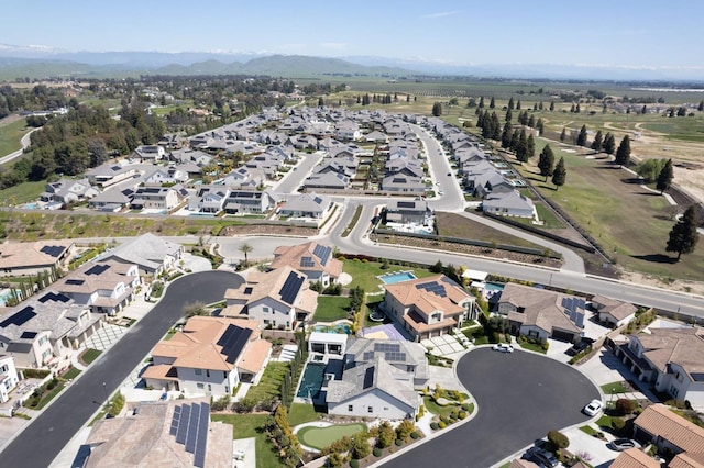 birds eye view of property with a residential view