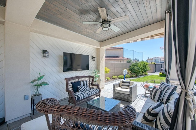 view of patio / terrace with fence, outdoor lounge area, and a ceiling fan