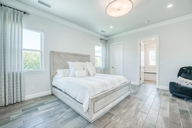 bedroom featuring visible vents, baseboards, and wood finish floors
