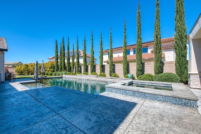 view of pool with a patio area, a fenced in pool, and fence
