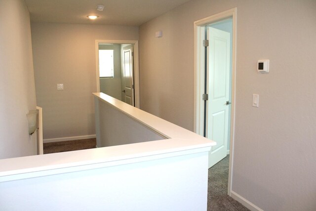2060 N Walker Ln, Clovis, CA 93619 - hall with dark carpet, baseboards, and recessed lighting