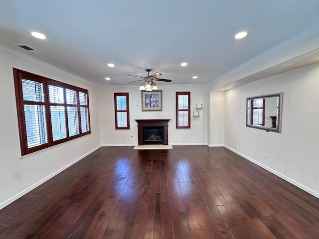 8352 N Shallot Way, Fresno, CA 93720 - unfurnished living room featuring ornamental molding, dark wood-type flooring, ceiling fan, and a healthy amount of sunlight