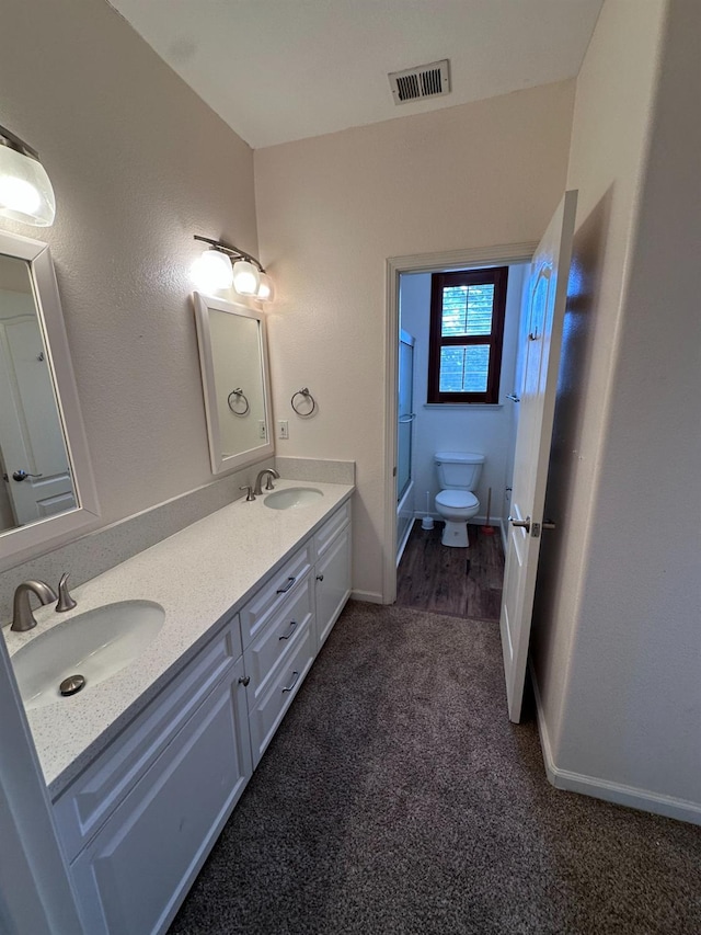 8352 N Shallot Way, Fresno, CA 93720 - bathroom featuring walk in shower, visible vents, a sink, and toilet