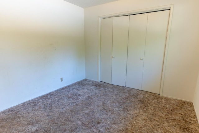 474 Dartmouth Ave, Coalinga, CA 93210 - unfurnished bedroom featuring carpet floors and a closet