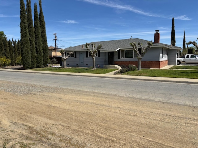 474 Dartmouth Ave, Coalinga, CA 93210 - ranch-style home with brick siding, a front yard, and a chimney