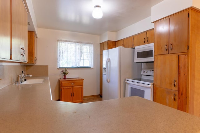 474 Dartmouth Ave, Coalinga, CA 93210 - kitchen with white appliances, a sink, and light countertops
