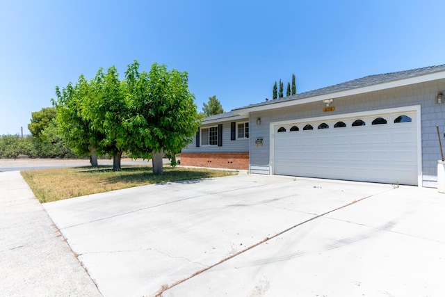474 Dartmouth Ave, Coalinga, CA 93210 - ranch-style home with driveway, an attached garage, and brick siding