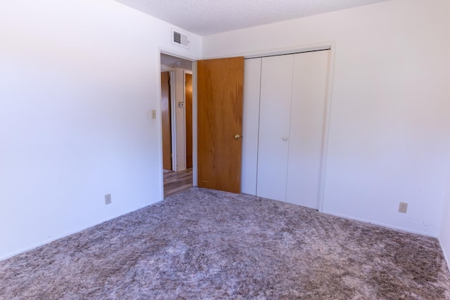 474 Dartmouth Ave, Coalinga, CA 93210 - unfurnished bedroom featuring carpet and a closet