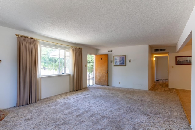 474 Dartmouth Ave, Coalinga, CA 93210 - carpeted spare room featuring a textured ceiling