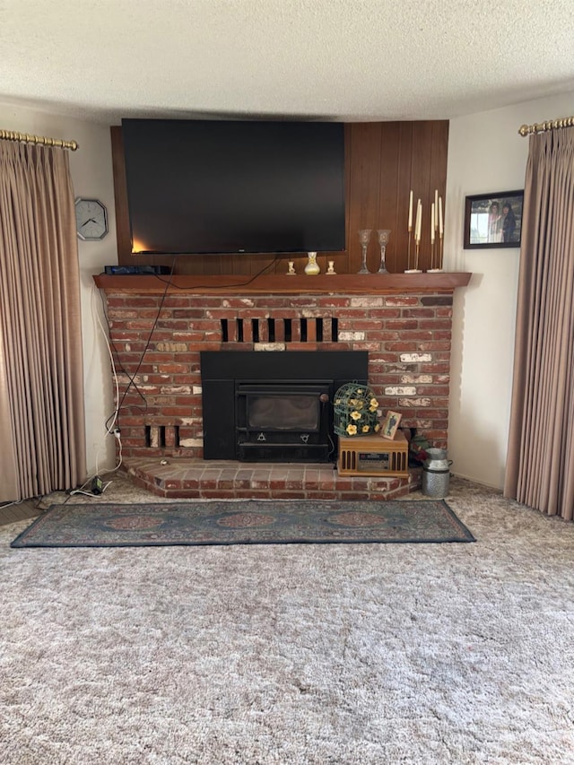 474 Dartmouth Ave, Coalinga, CA 93210 - living area with carpet flooring, a textured ceiling, and a fireplace