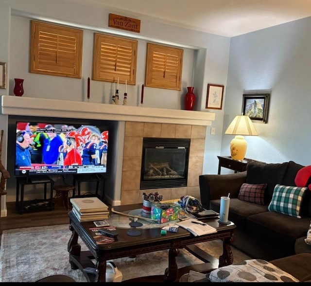 1068 San Ramon Ave, Madera, CA 93637 - living room featuring wood finished floors and a fireplace