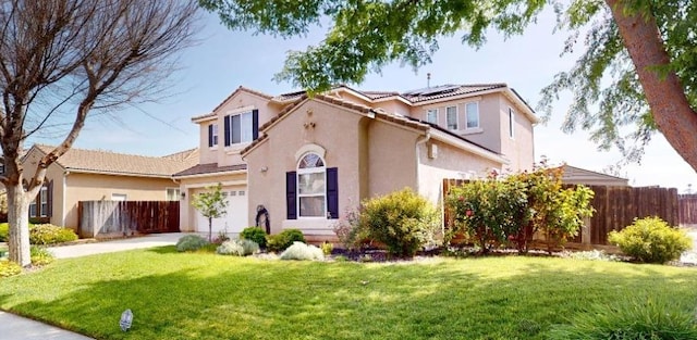 1051 N Coventry Ave, Clovis, CA 93611 - view of front of home with stucco siding, solar panels, driveway, and a tile roof