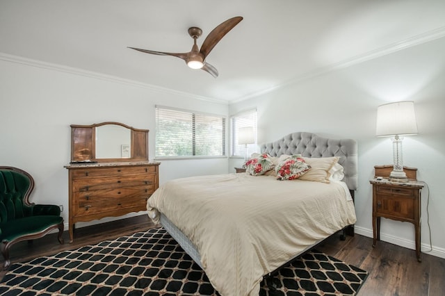 bedroom with ceiling fan, baseboards, crown molding, and wood finished floors