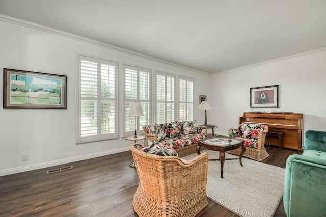 living area with plenty of natural light, crown molding, and wood finished floors