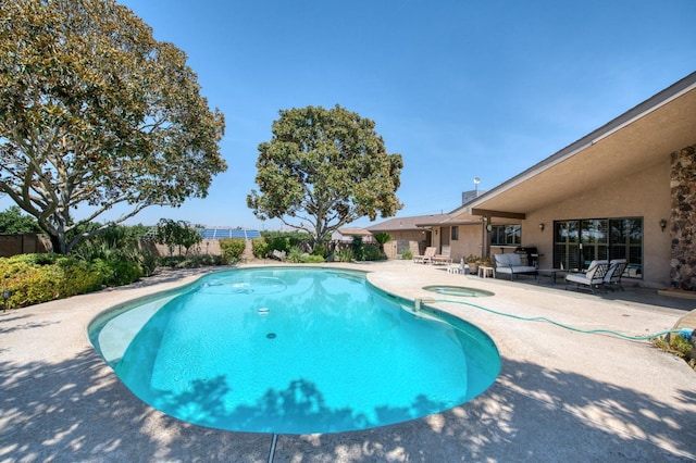 view of swimming pool with a fenced in pool, a patio area, an in ground hot tub, and fence private yard