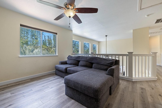 3232 Greenfield Ave, Clovis, CA 93611 - living room with a ceiling fan, wood finished floors, and a textured ceiling