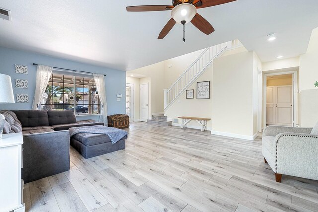 3232 Greenfield Ave, Clovis, CA 93611 - living area featuring a ceiling fan, stairs, light wood-type flooring, and recessed lighting