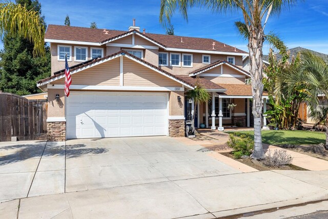 3232 Greenfield Ave, Clovis, CA 93611 - view of front facade with stone siding, concrete driveway, and stucco siding