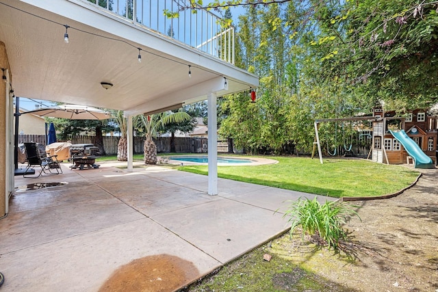 3232 Greenfield Ave, Clovis, CA 93611 - fenced backyard featuring a patio and a playground