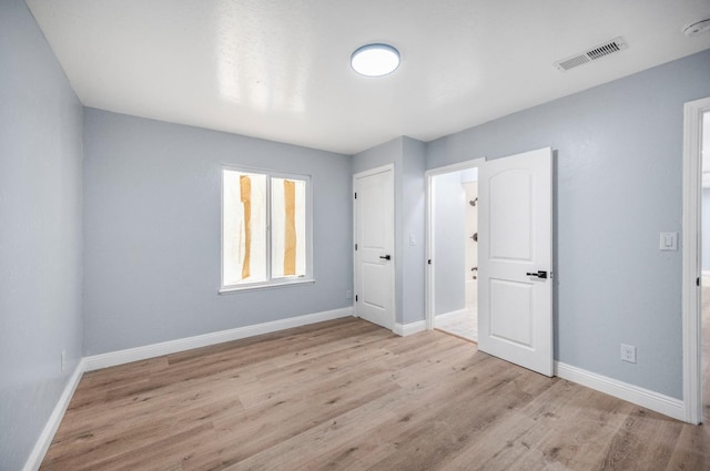5934 E Dakota Ave, Fresno, CA 93727 - unfurnished bedroom featuring baseboards, wood finished floors, and visible vents