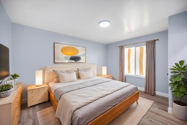 5934 E Dakota Ave, Fresno, CA 93727 - bedroom with baseboards and light wood-style flooring