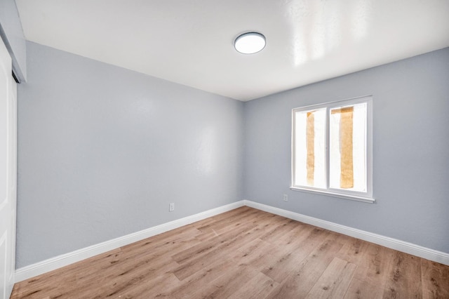 5934 E Dakota Ave, Fresno, CA 93727 - spare room with baseboards and wood finished floors