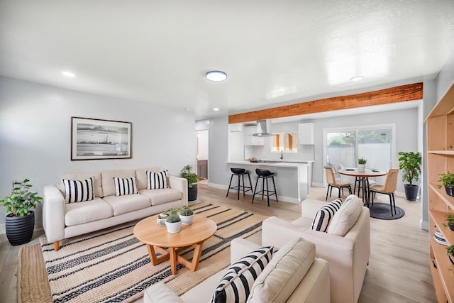 5934 E Dakota Ave, Fresno, CA 93727 - living room featuring light wood finished floors, beam ceiling, baseboards, and recessed lighting
