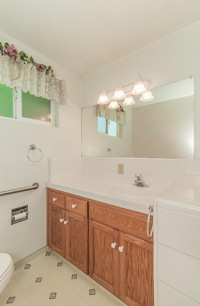 720 I St, Parlier, CA 93648 - bathroom with tile patterned floors, vanity, and toilet