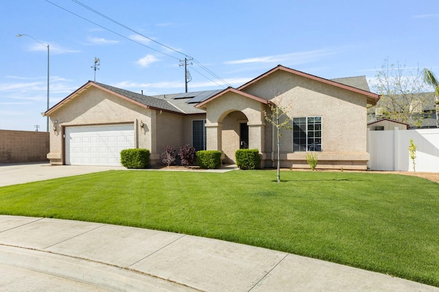 683 W Forest St, Kingsburg, CA 93631 - ranch-style home with fence, stucco siding, concrete driveway, and solar panels