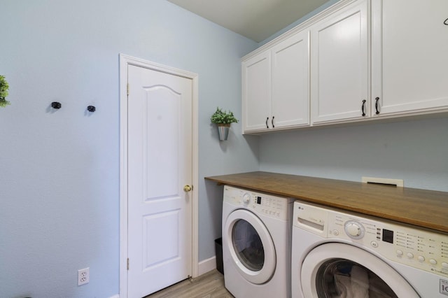683 W Forest St, Kingsburg, CA 93631 - laundry room with baseboards, cabinet space, light wood-style flooring, and independent washer and dryer