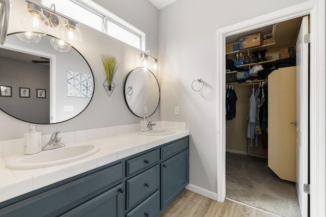 683 W Forest St, Kingsburg, CA 93631 - full bath with double vanity, a sink, and a walk in closet