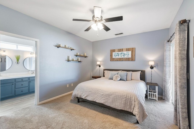 683 W Forest St, Kingsburg, CA 93631 - bedroom featuring visible vents, light carpet, baseboards, ceiling fan, and connected bathroom