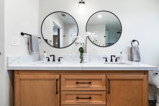 8683 N Colfax Ave, Fresno, CA 93720 - full bath featuring visible vents, a sink, double vanity, and toilet